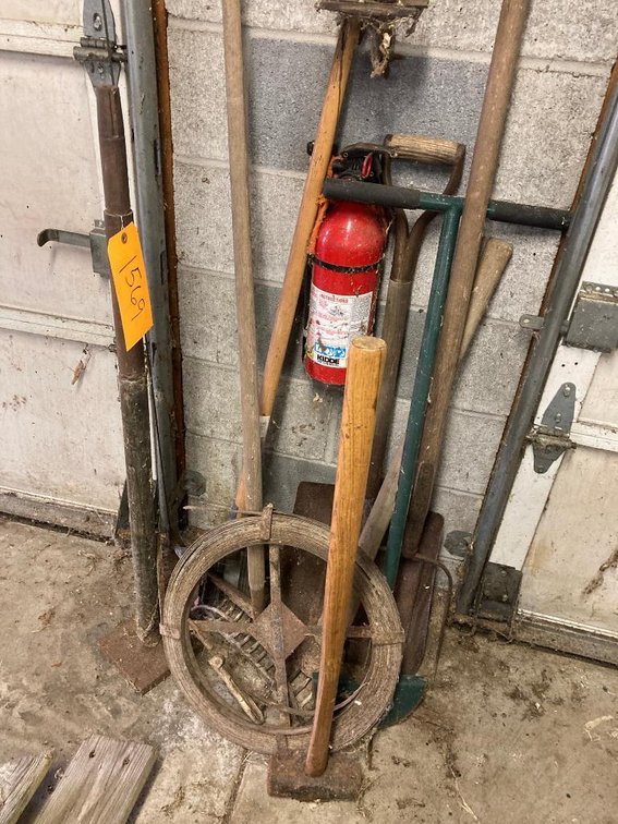 Lot of hand tools:  Pitchforks, sledgehammers, sewer snake