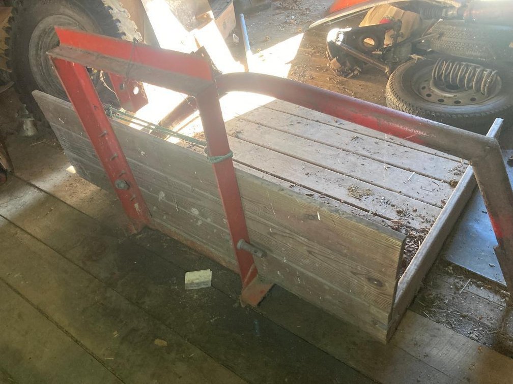 Front attachment and a picker for a tractor or front loader