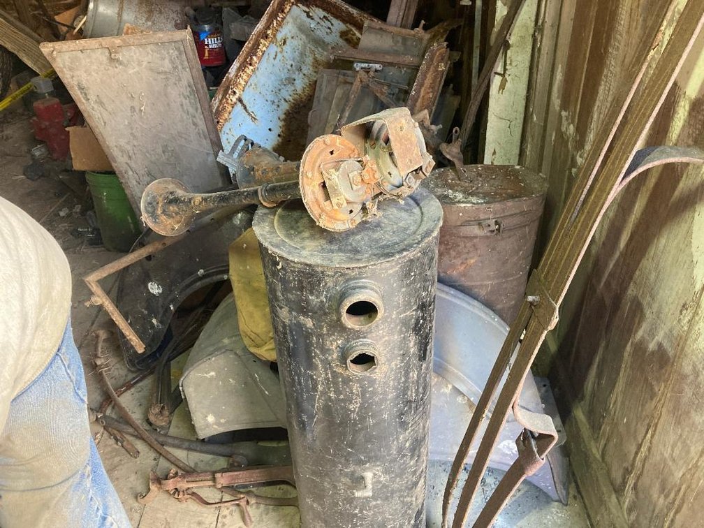 Lot of auto parts, some Model T parts:  Gas tanks, fenders, windshield frames