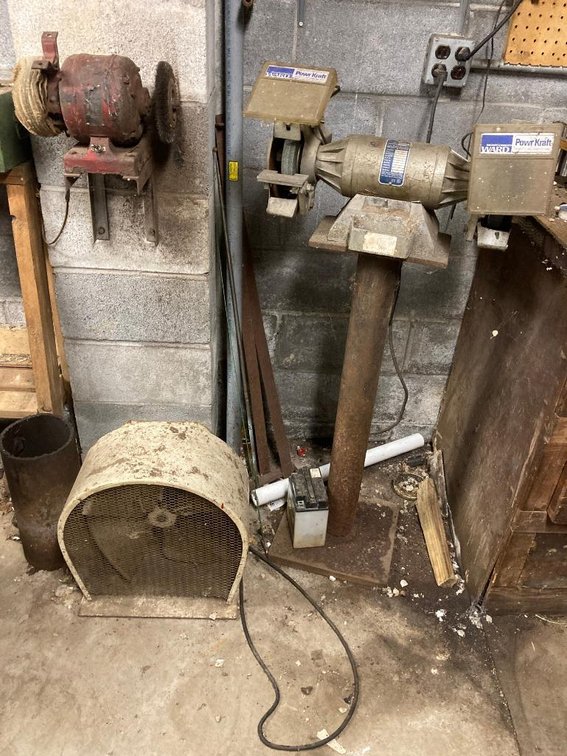 2 Bench grinders, metal fan, misc. lot of shop tools on the bench - not tested