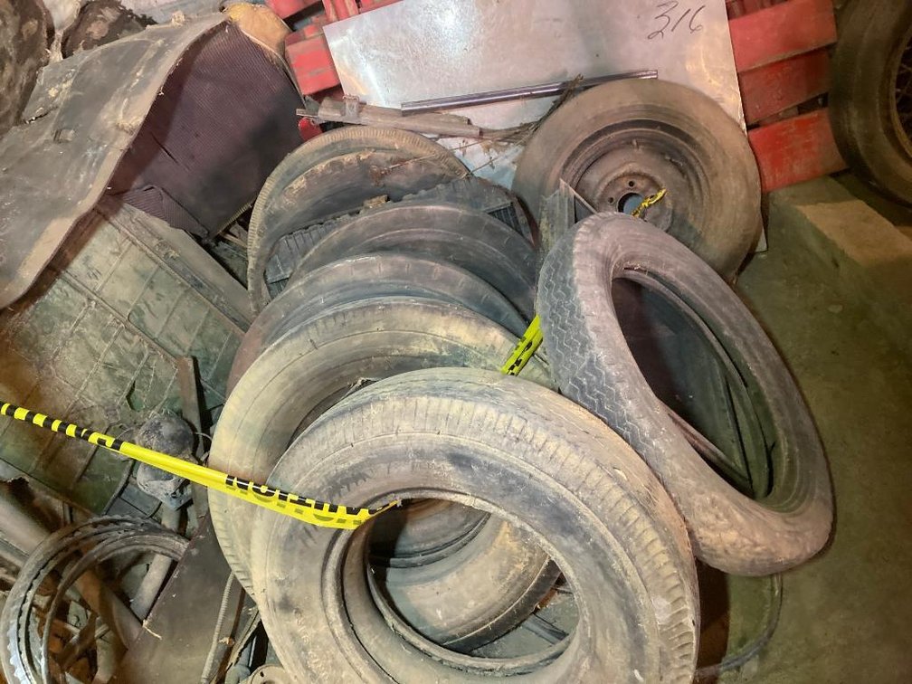Lot of automotive parts:  Tires, wheels, tail pipes, springs, misc. auto parts