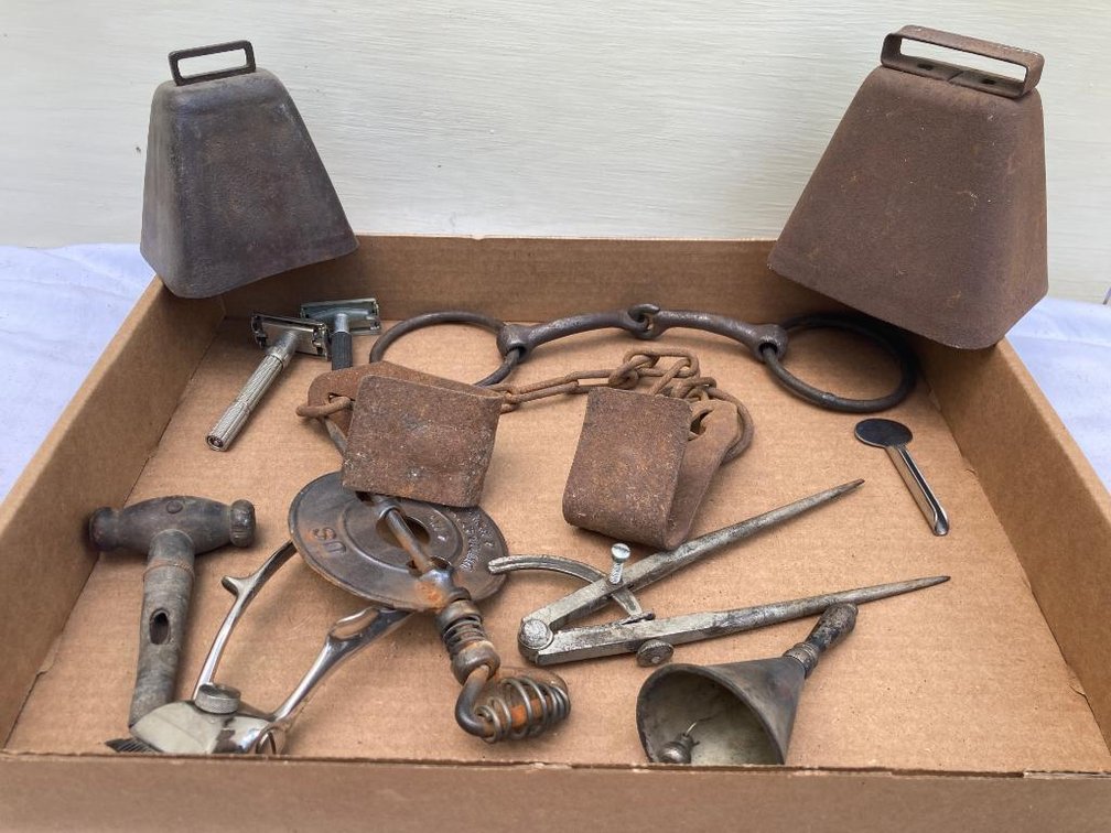 Lot of primitives:  Bells, cow hobbles, flue cover, razors, compass