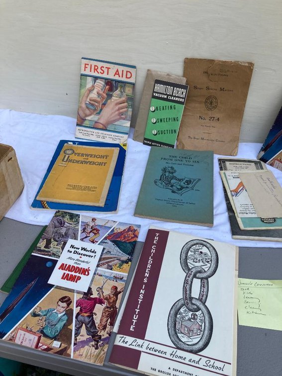 Lot of paper items:  First Aid book, New World's Discovery, Aladdin Lamp, Overweight and Underweight book, etc.