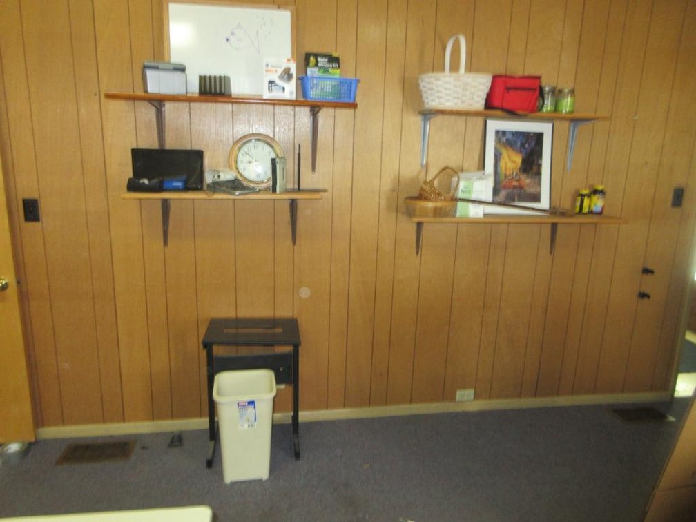Contents of wall:  4 Shelves, clock, basket, picture, metal stand