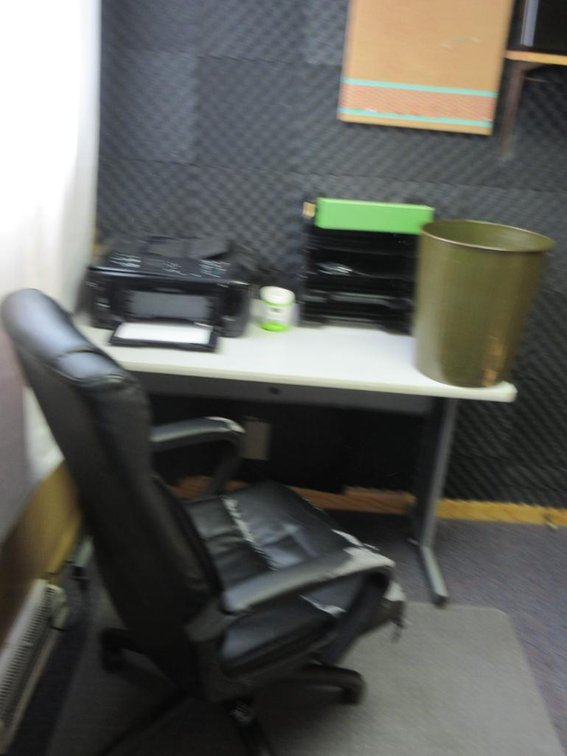 Contents of room:  Small desk, chair, printer/copier, pictures, shelves