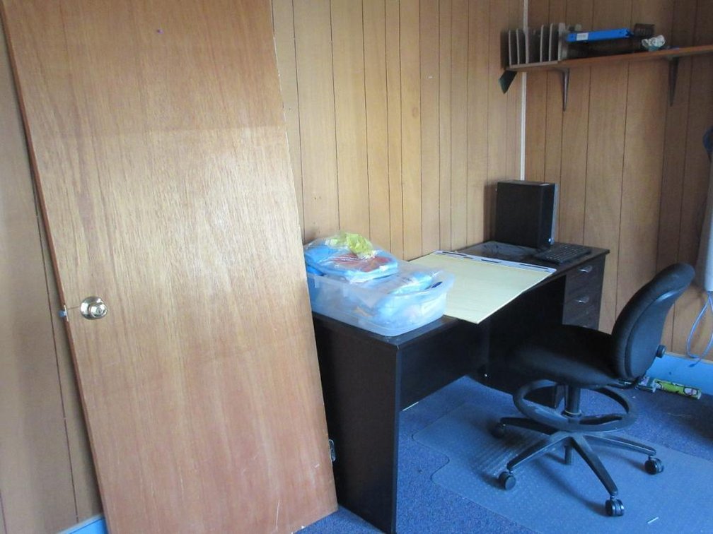 Desk, office chair, contents of shelf
