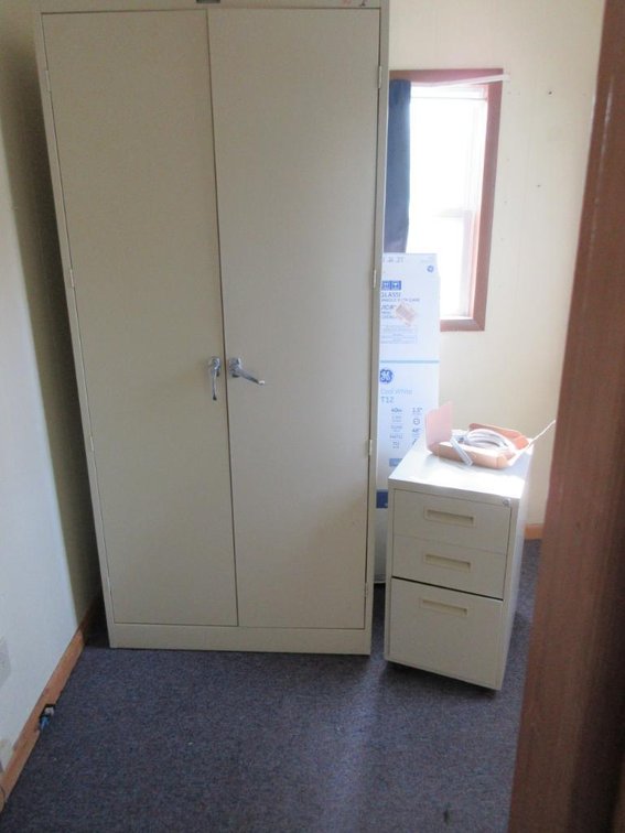 Contents of room:  Metal cabinet, small file cabinet