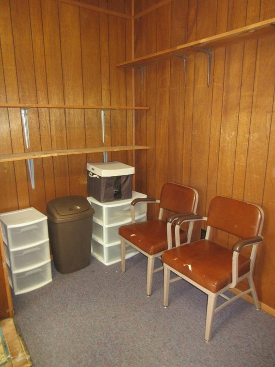 Contents of corner:  2 Chairs, storage bins, shelves