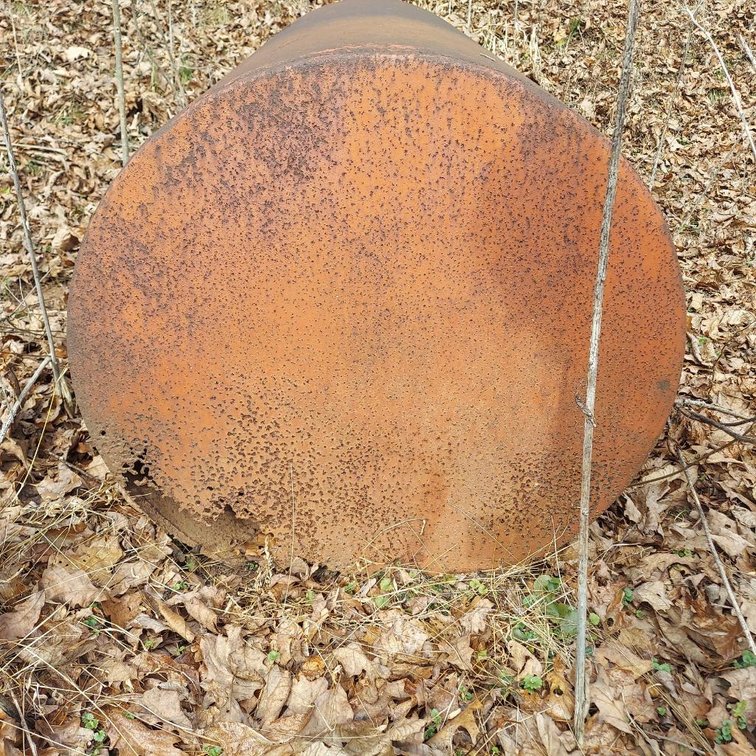 Red Metal Tank with holes