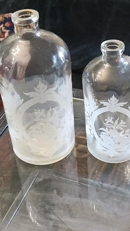 2 etched glass bottles