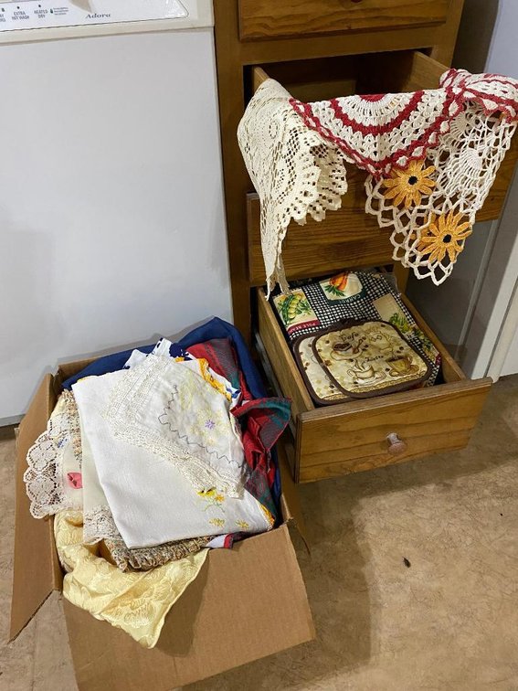 Contents of 2 kitchen drawers and a box:  Vintage potholders, doilies, linens, etc.