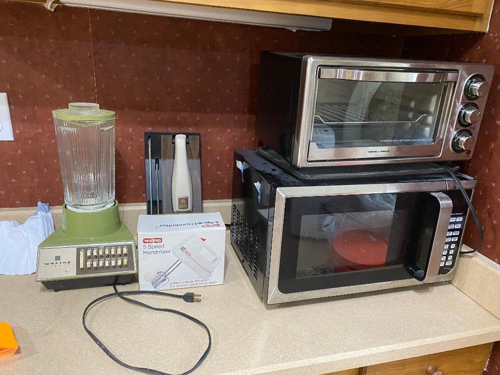 Lot of appliances: Hamilton Beach microwave, toaster oven, Waring blender, etc.