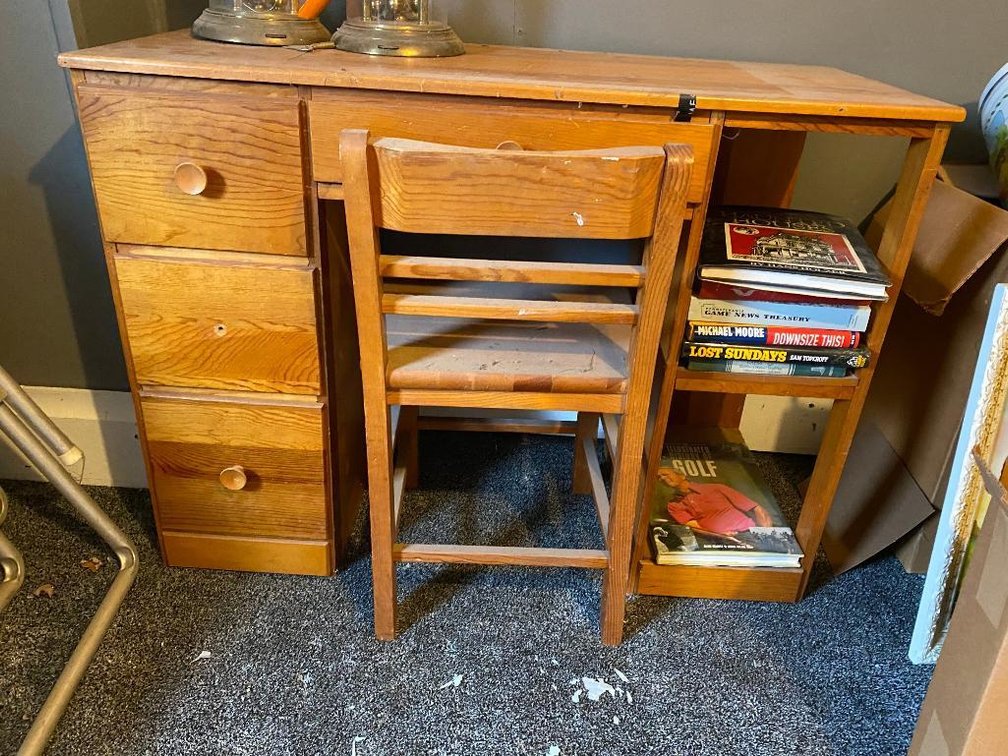 Wood child's desk, chair and some books