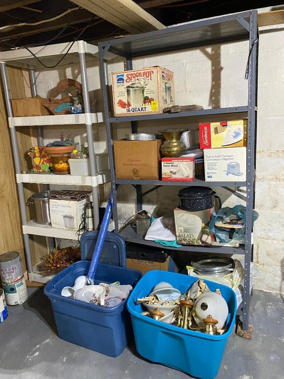 Metal shelf and plastic shelf w/ contents; mostly cookware, bakeware, dishes, chandelier light