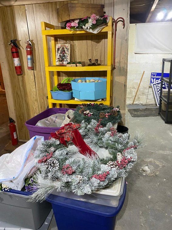 Plastic shelf and containers; mostly Christmas and decorations