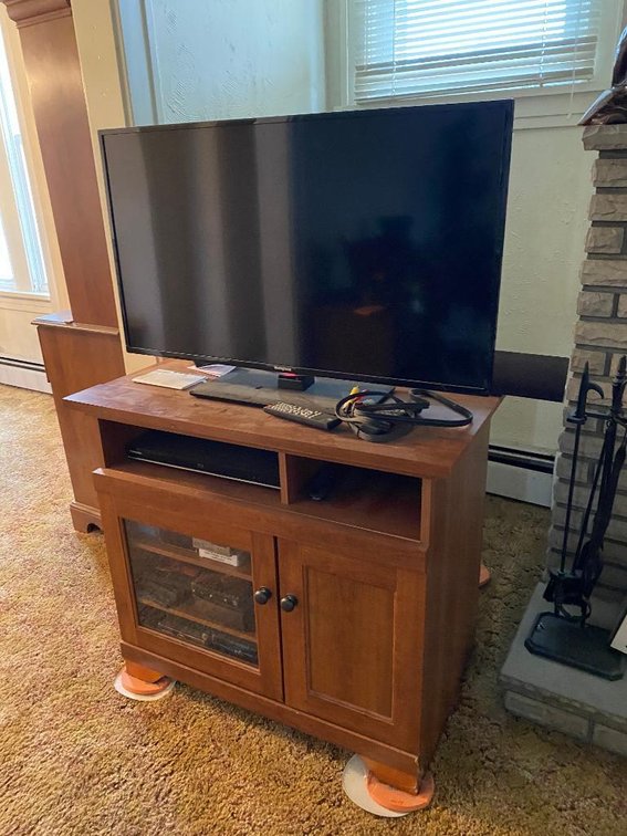Wood TV stand and Westinghouse 41" TV model DWM40F1Y1-C and a Vizio sound bar