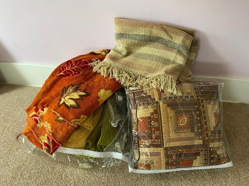 Lot of comforters, blankets and towels