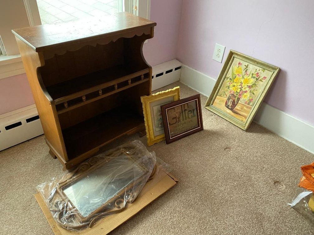Small bookshelf w/pictures and a mirror