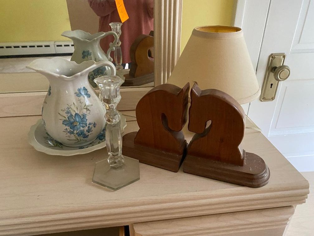 Contents on the top of dresser:  Vintage pitcher and bowl, wood  horse bookends, lamp, etc.