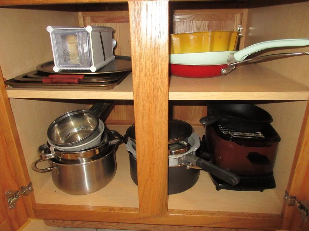 Contents of island:  Pots, pans, cake pans, aluminum foil, freezer bags