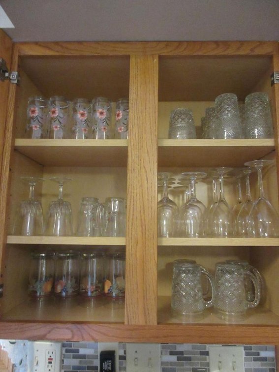 Contents of the cabinet:  Cups, stemmed glasses, handled mugs