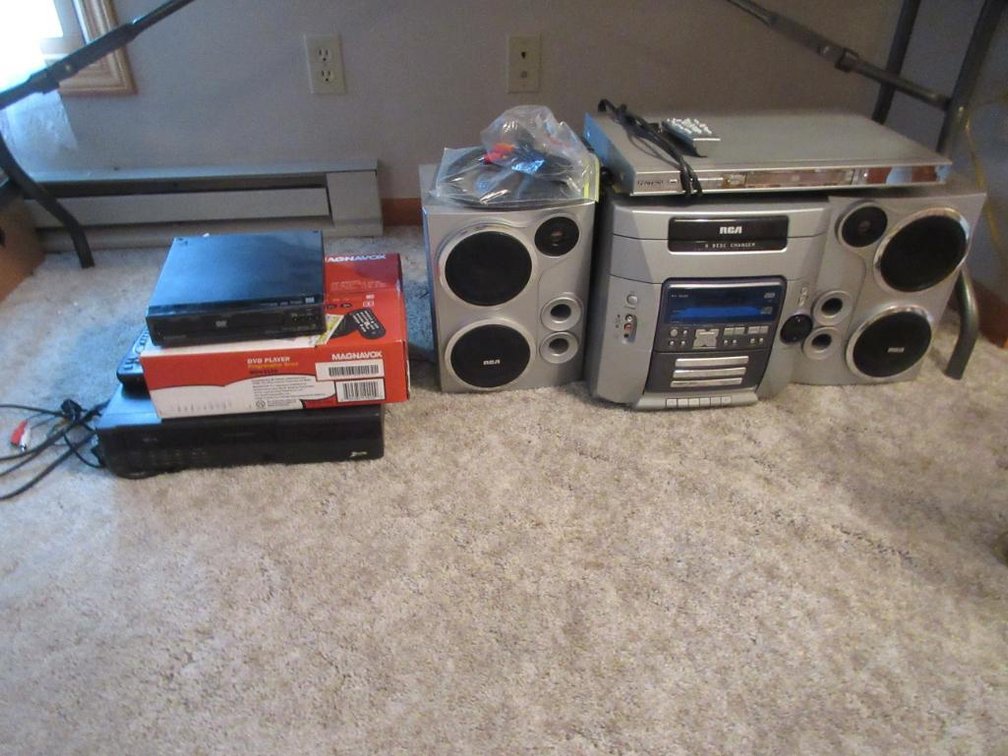 RCA stereo system, Zenith VHS player, Magnavox DVD player