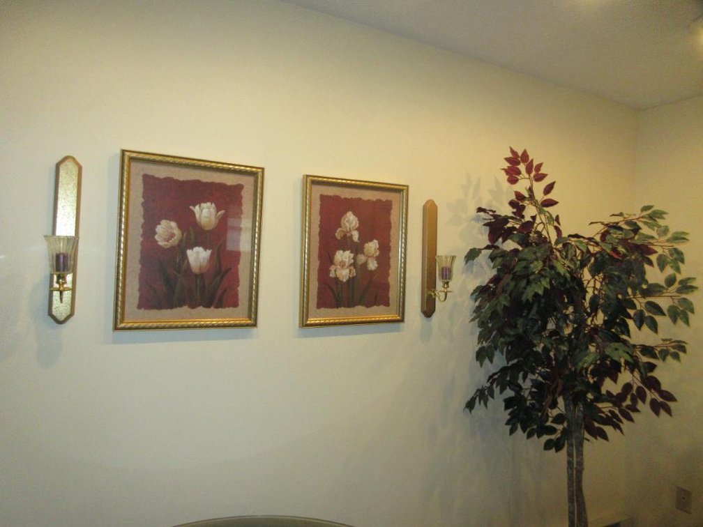 Framed wall art, sconces and faux tree