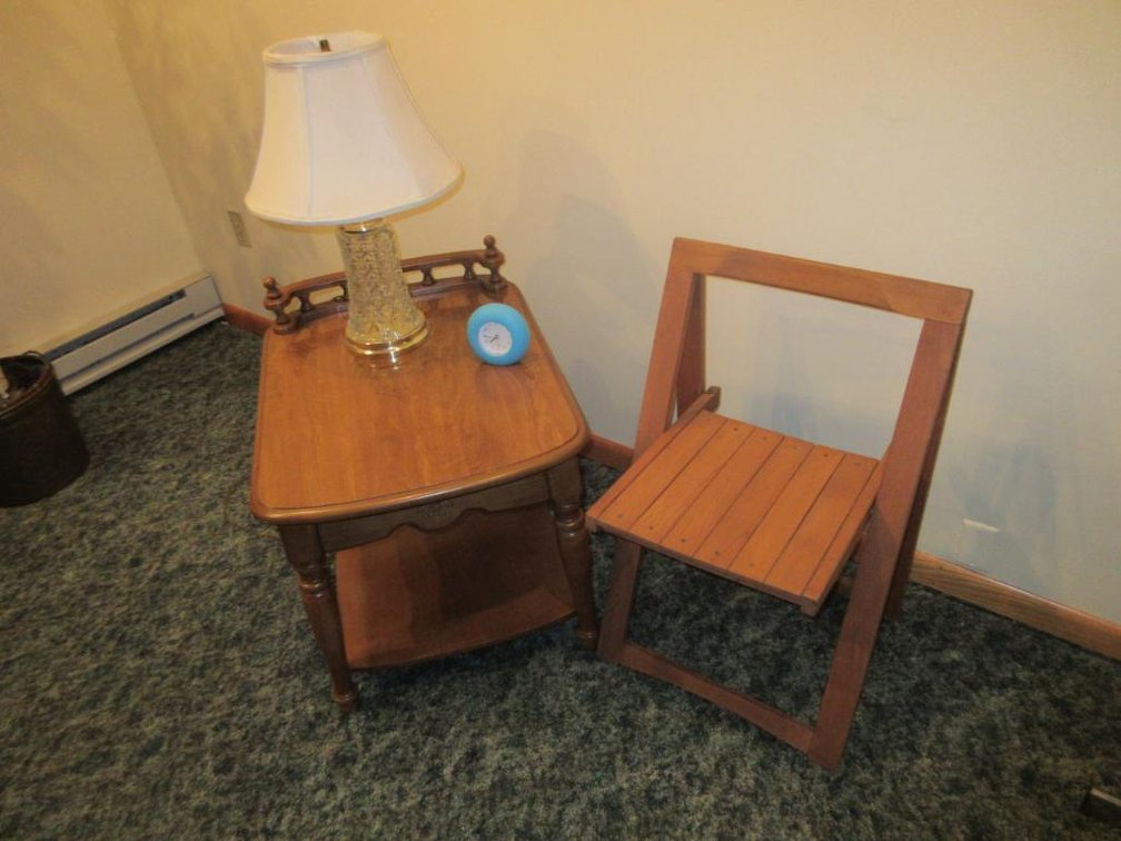 End table, table lamp and folding chair