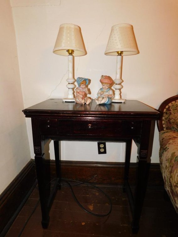 Empty sewing machine base w/ lamps and figurines