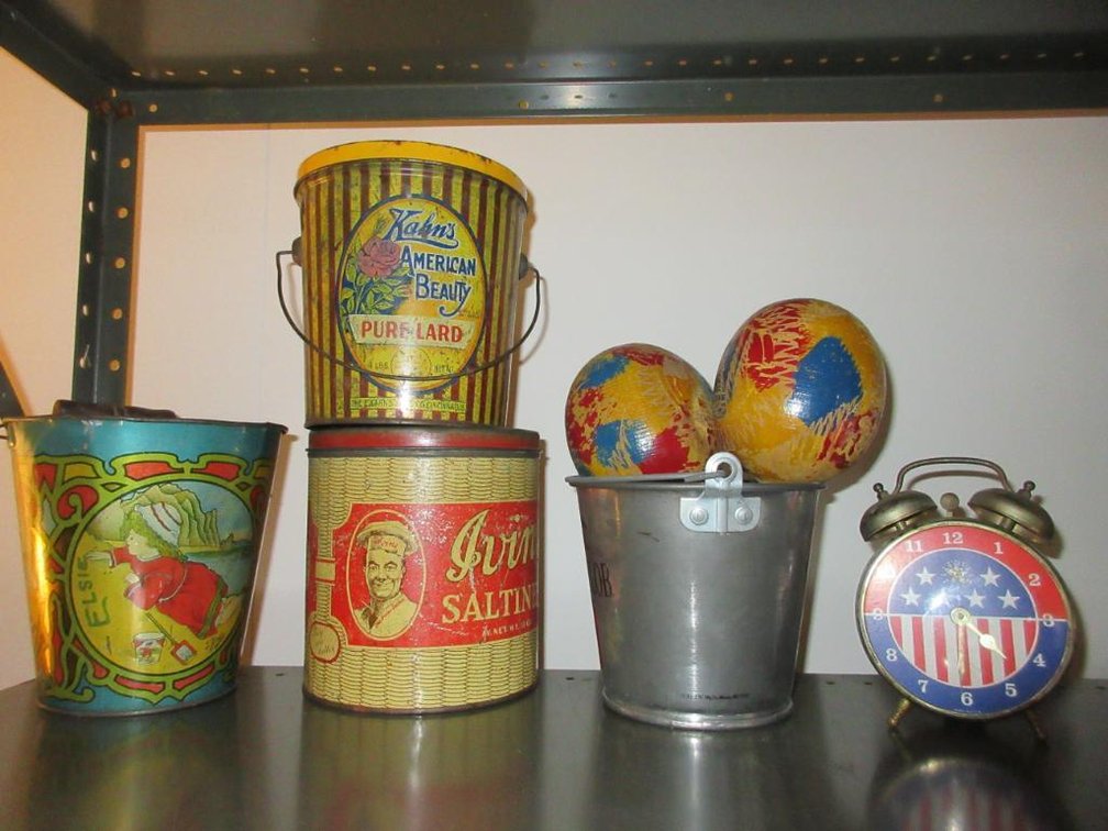 Vintage advertising tins and maracas w/ clock