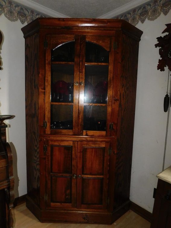 Handcrafted lighted corner cupboard
