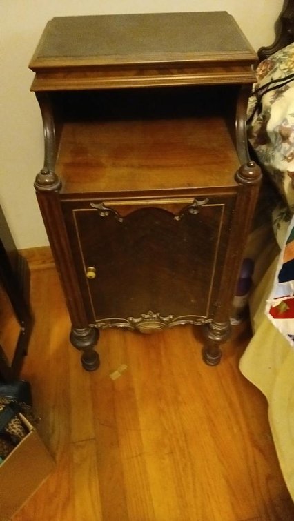 Vintage night stand with contents in bottom cabinet