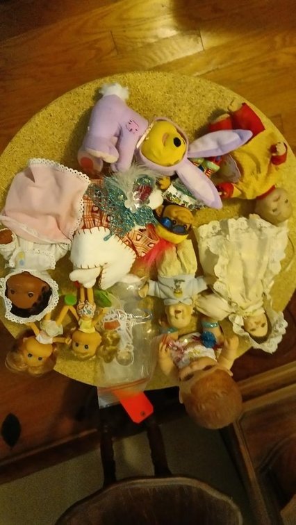 Assortment of dolls and stuffed animals