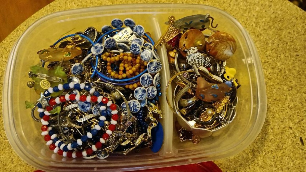 Costume jewelry in plastic container