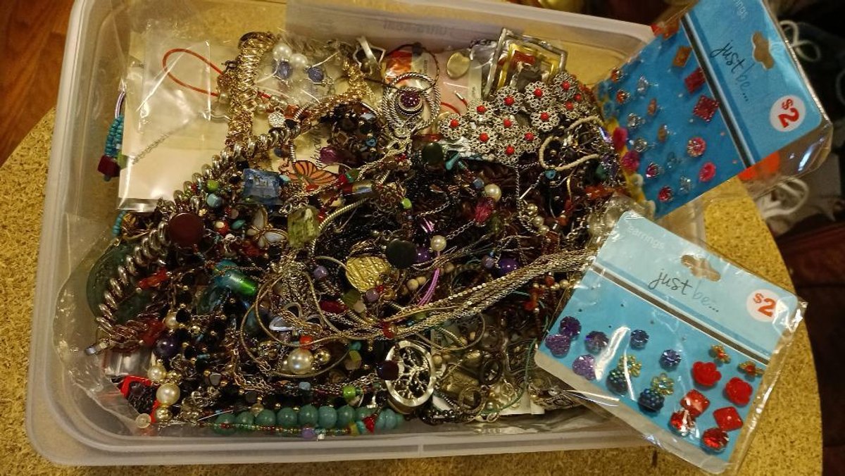 Costume jewelry in plastic container