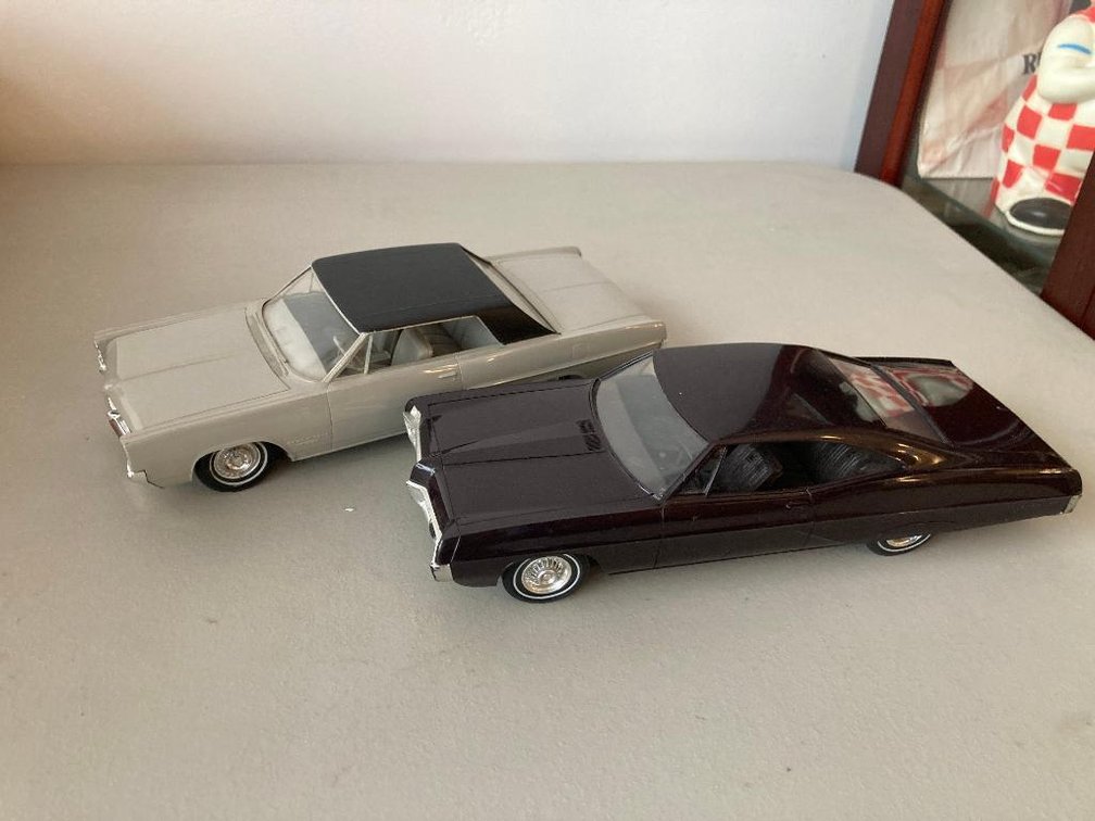 2 Pontiac Promo cars:  One is a '64 Grand Prix and a '67 Bonneville