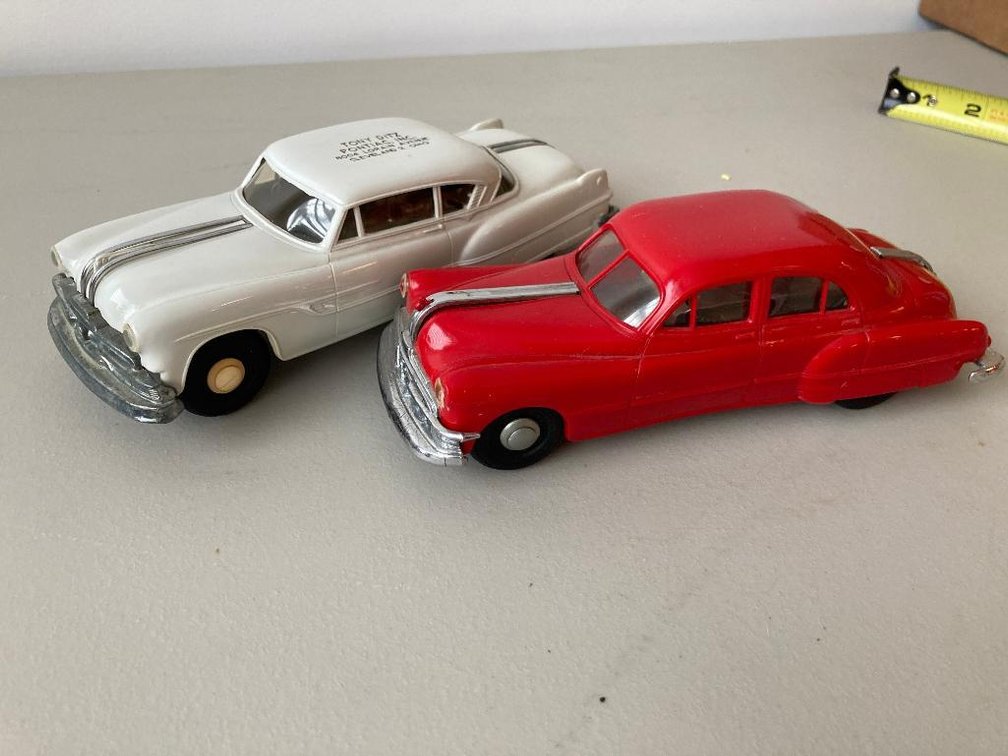2 Promotional cars:  One is a Friction car and other is damaged