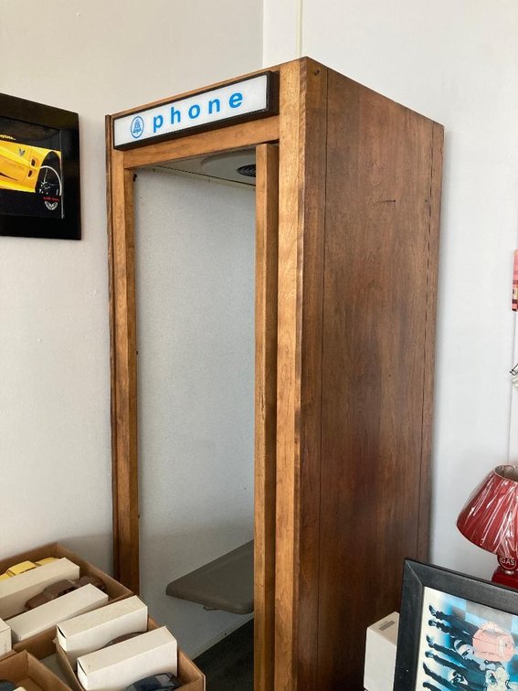 Wooden phone booth w/ Electro Co. coin-operated phone