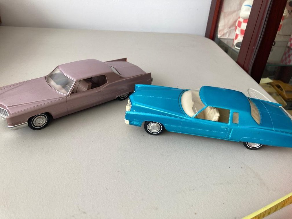 2 Cadillacs; one is a Deville and other Eldorado, both Promos