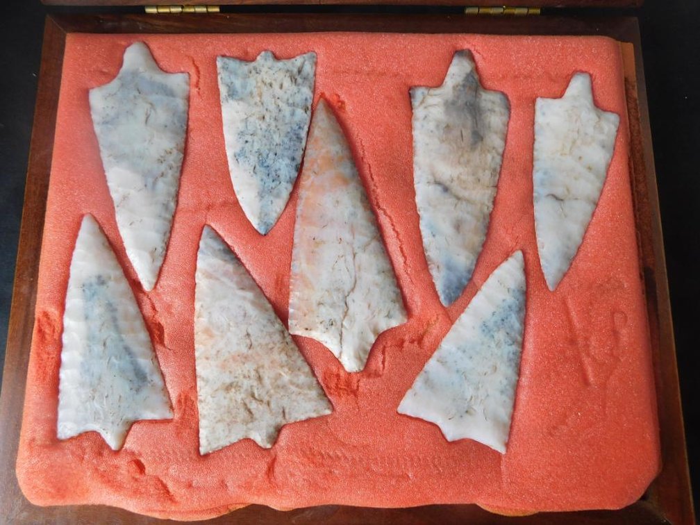 Collection of arrowheads in case