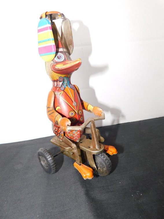 Collectible tin toy duck on bike - tested