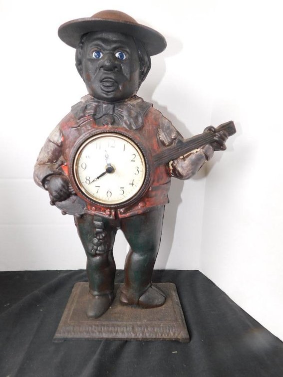 Cast metal black memorabilia clock/bank