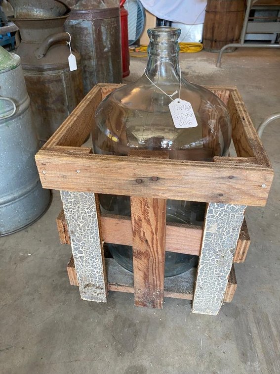 Vintage water jug and a wooden crate