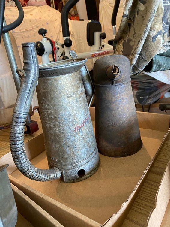 Half-gallon Huffman Oil can and another oil can