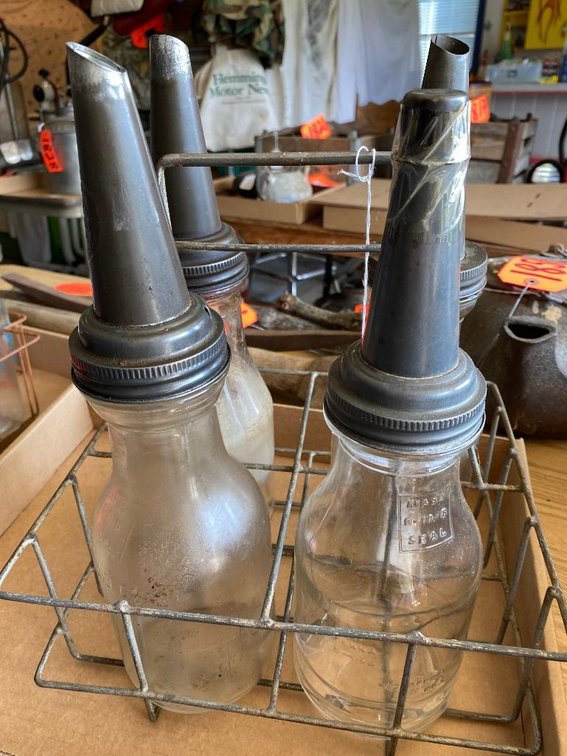 Metal carrier w/ vintage oil bottles