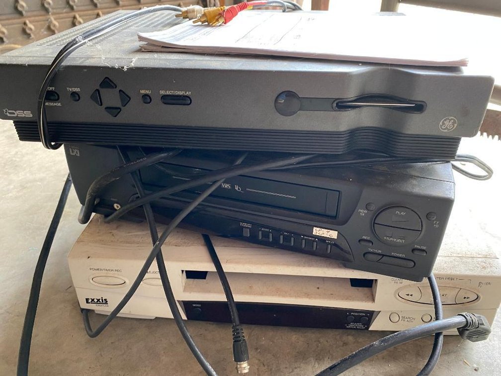 3 VHS and DVD players; one is a Sylvania