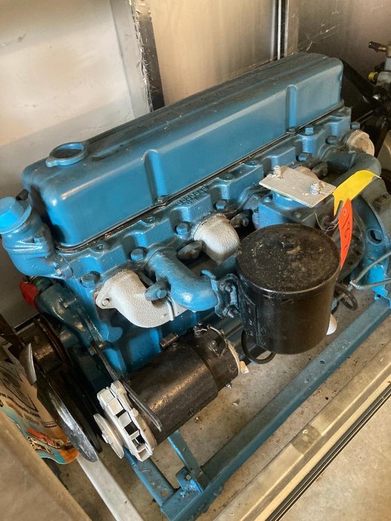 1950's Chevrolet 235 cubic inch 6-cylinder motor w/ generator and rolling stand as found