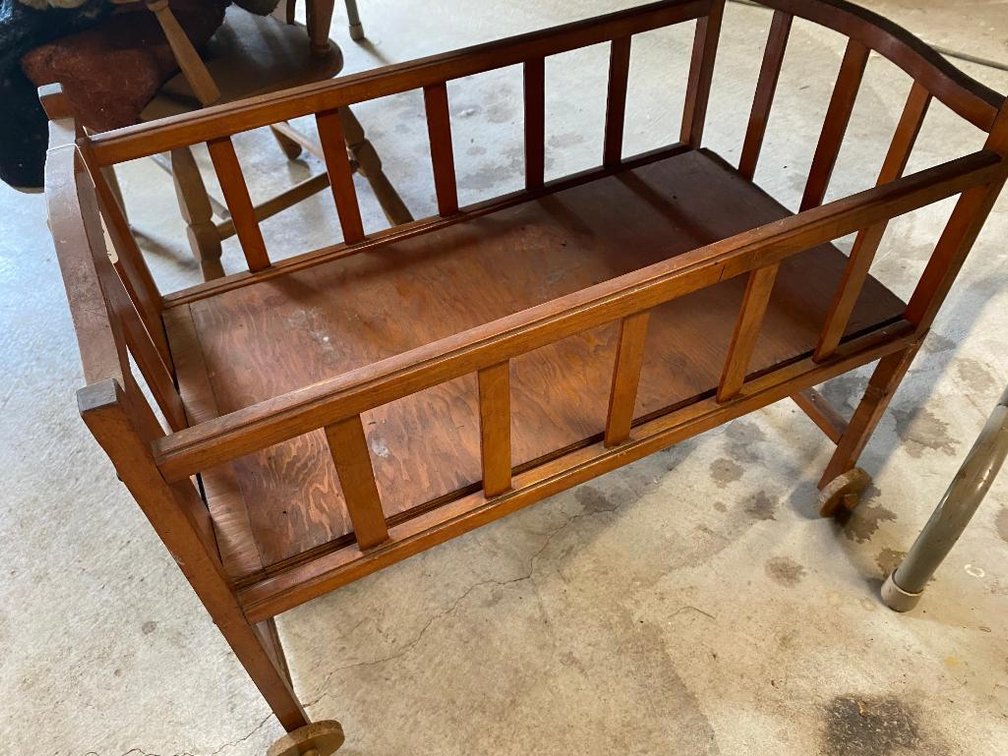 Child's baby doll cradle w/ wooden wheels from the 1940's