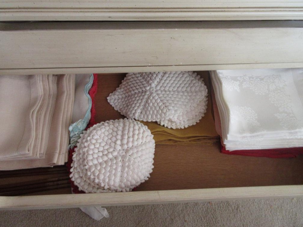 contents in bottom of China cabinet