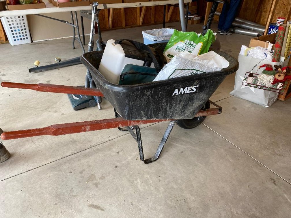 Ames plastic wheel barrow, potting mix, etc
